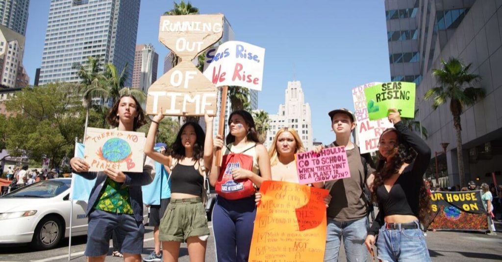 Young kids holding signs in protest