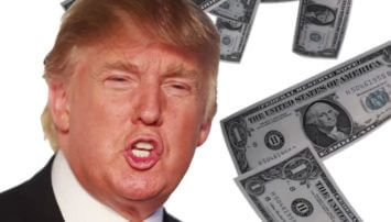 A photograph of Donald Trump with money shown falling down around him.