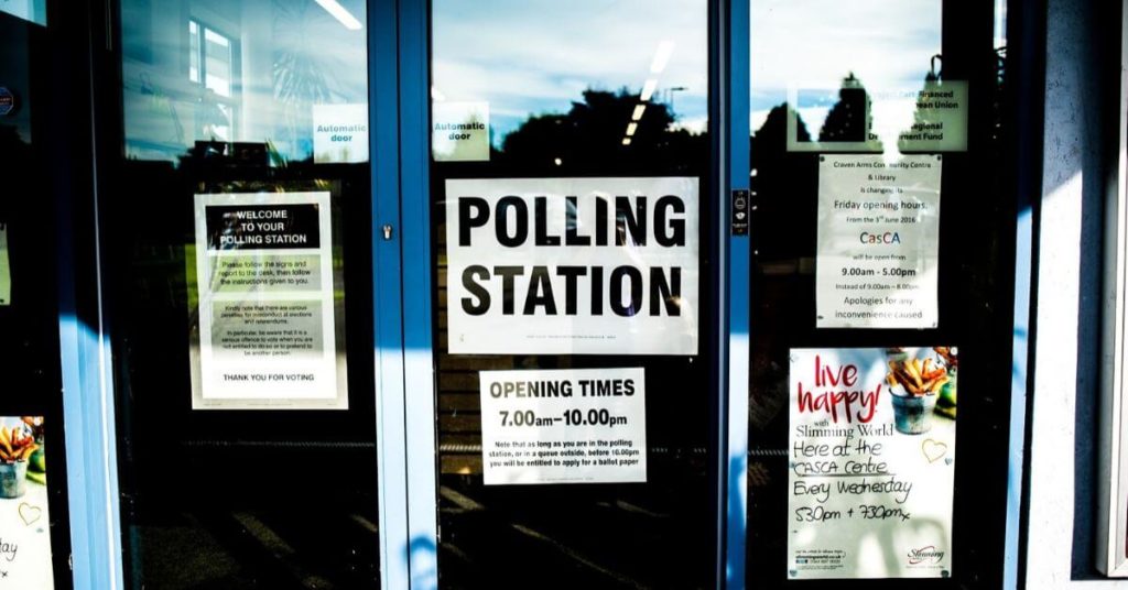 A photograph of a voter polling station.