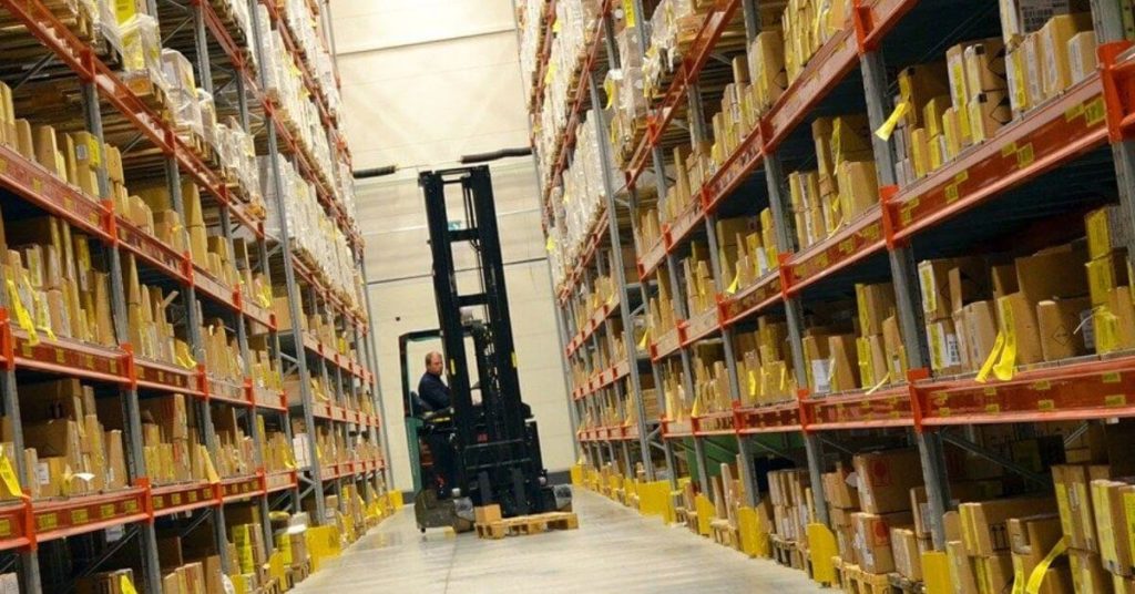 Man on a Hyster in an Amazon warehouse