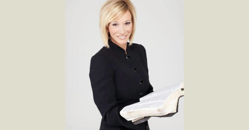 Paula White holding a bible