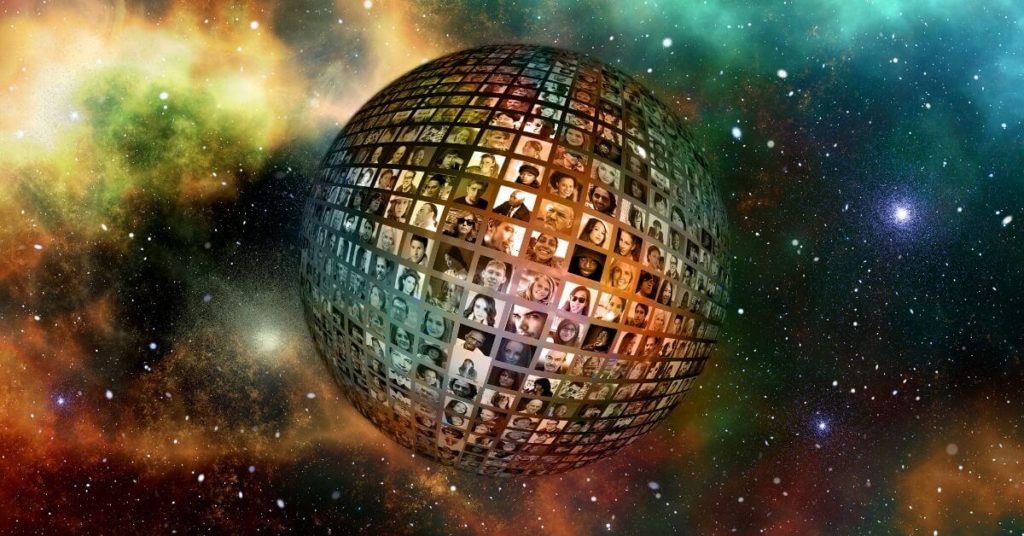 An image of a glitter ball made up of television screens.