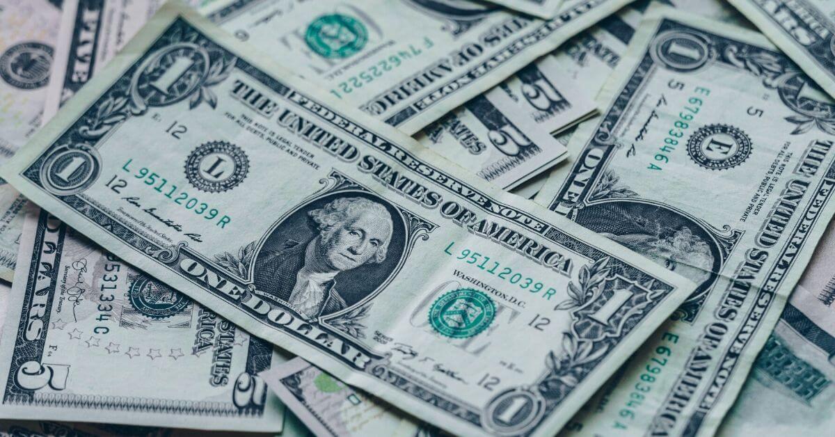A photograph of a few dollar bills.