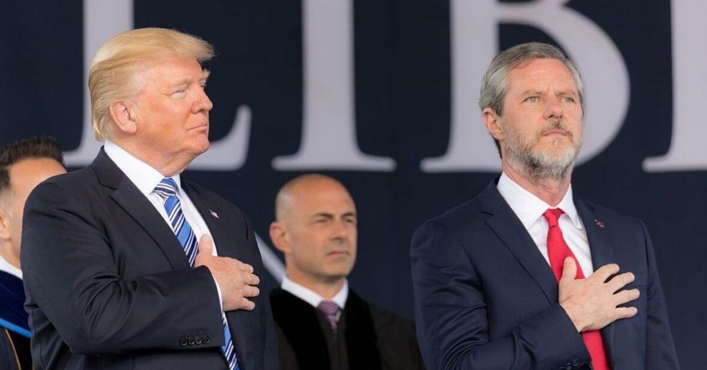 Trump and Jerry Falwell standing on a stage