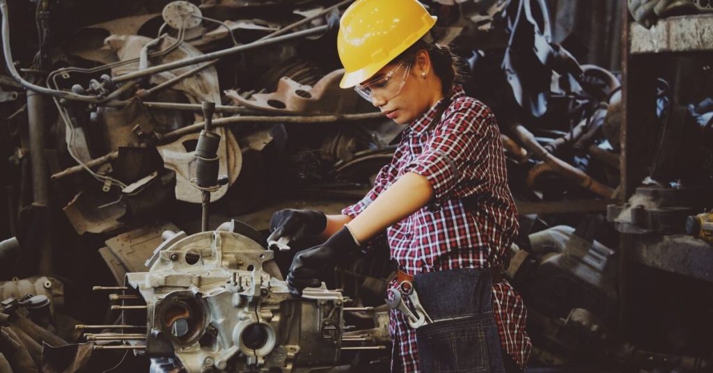 Female factory worker in a hard hat