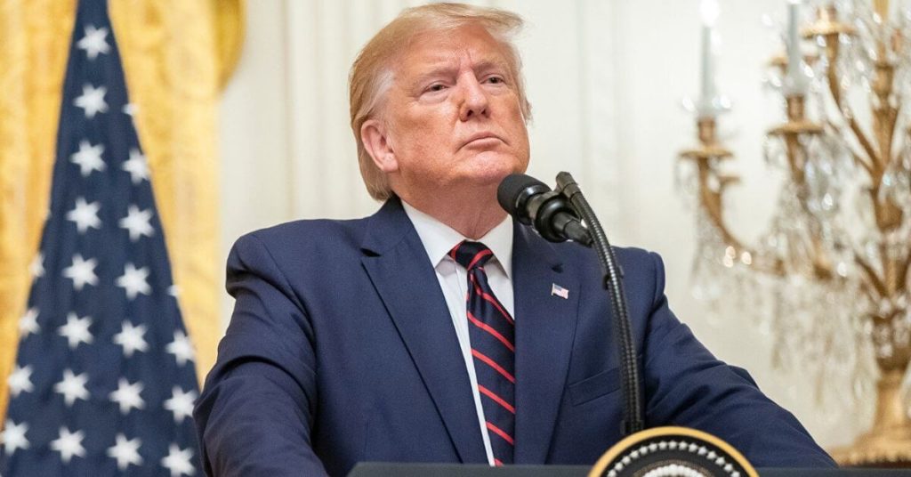 President Trump standing behind a podium