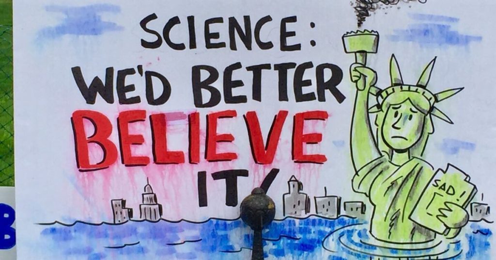 A drawing of the Statue of Liberty half covered in rising seas.