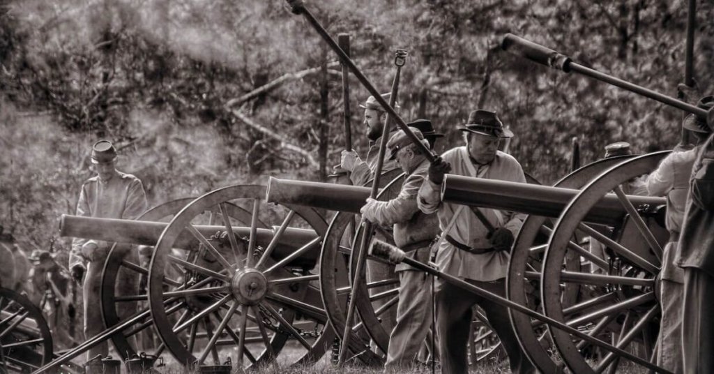 Sepia-toned photo of cannons and civil war soldiers