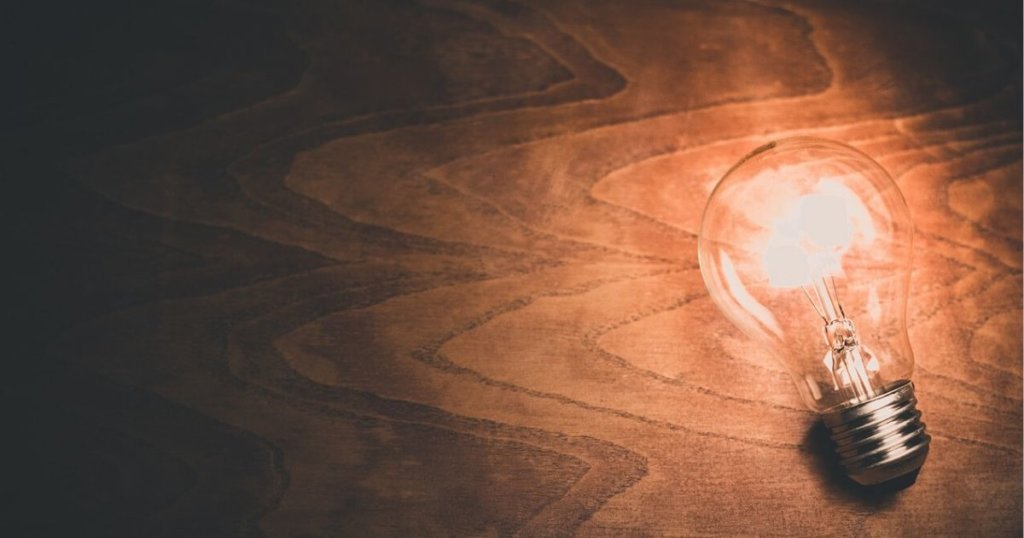 lightbulb lying on a piece of wood