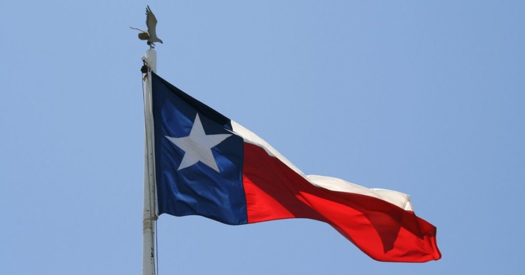 Texas flag waving in the wind.