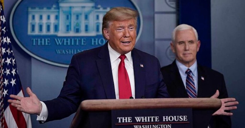 Trump standing behind a podium