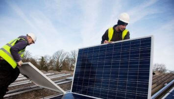 Two men working with solar panels