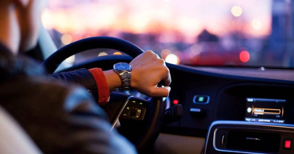 Interior shot of a man driving a car