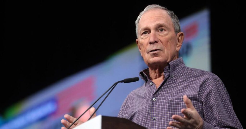 Mike Bloomberg standing at a podium