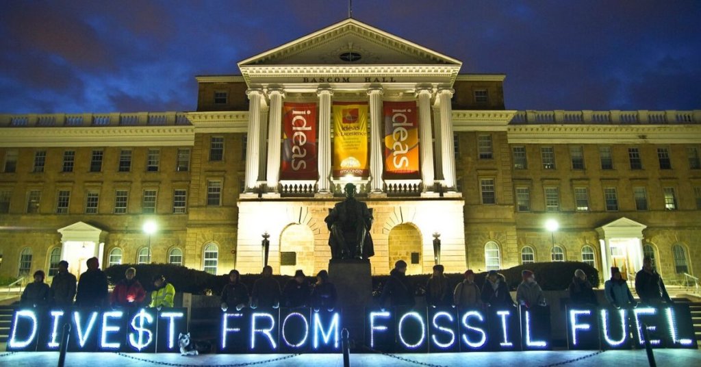 descriptive image of divest from fossil fuels illuminated signage
