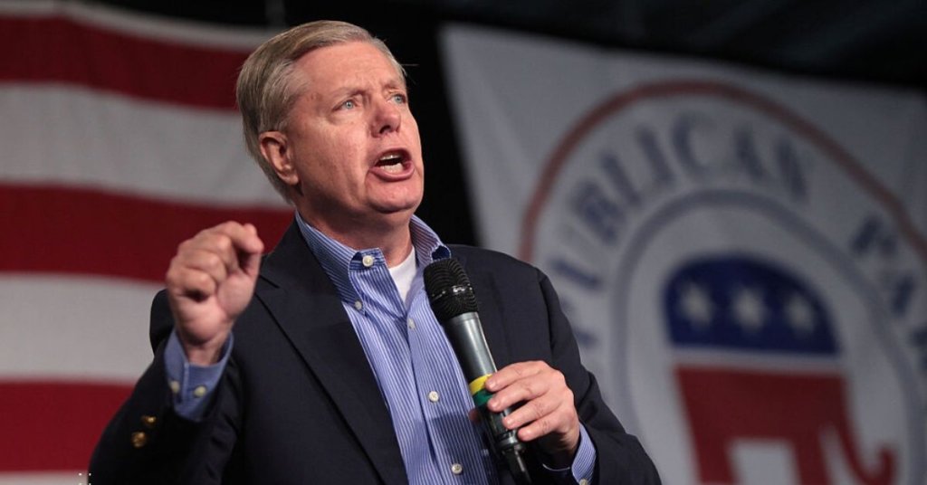 Senator Lindsey Graham holding a microphone
