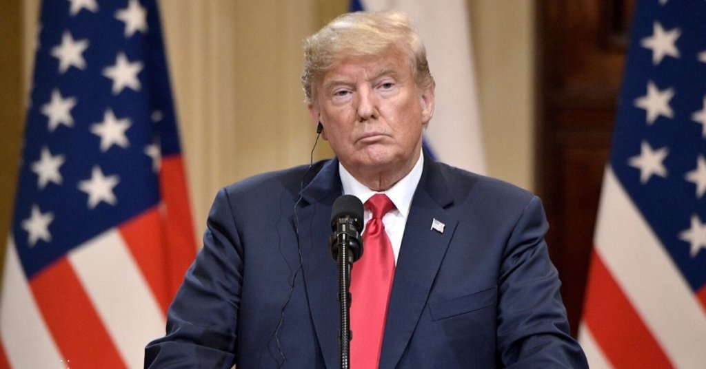 Trump standing at a podium