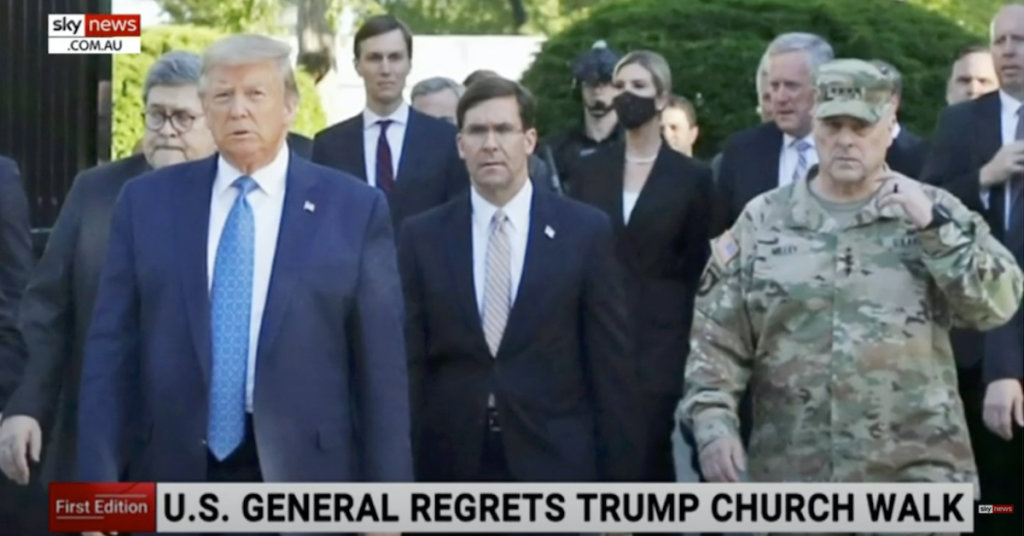 A photograph of Donald Trump walking through Lafayette Square with members of his administration, including General Mark Milley.