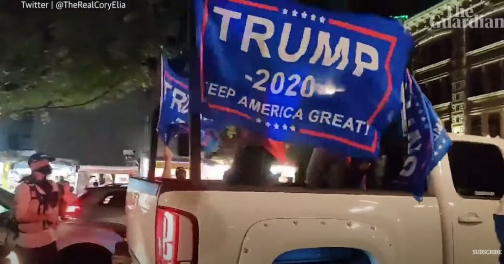 Truck with a Trump flag streaming in the wind
