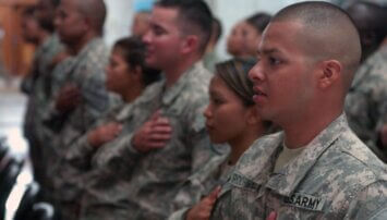 A group of Army soldiers hands on heart