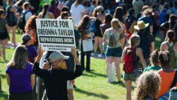 Demonstrator holding a sign in support of Breonna Taylor