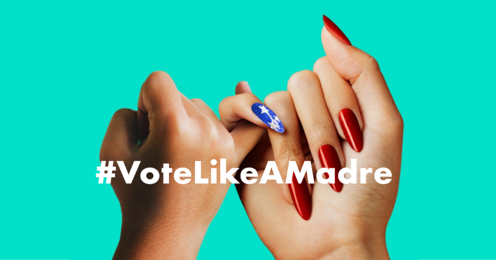 Two hands joined in the Vote Like A Madre pinky promise.