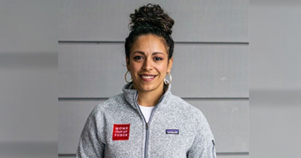 Yaritza Perez smiling in a gray jacket
