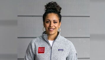 Yaritza Perez smiling in a gray jacket