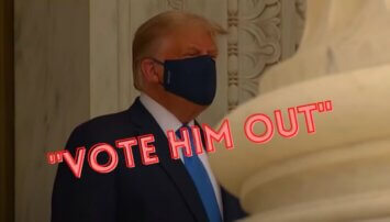Trump wearing a facemask with the words 'vote him out' printed across