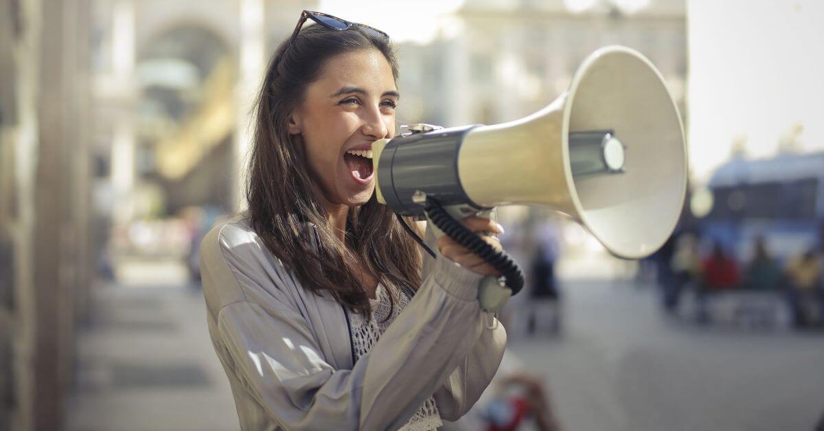 Woman speaking into a megaphone