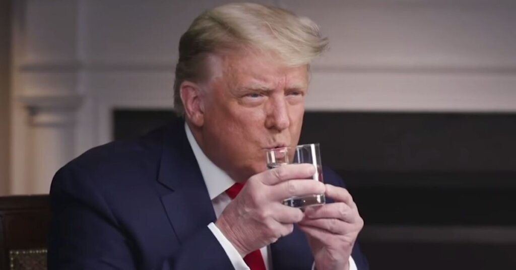 Trump trying to drink a glass of water