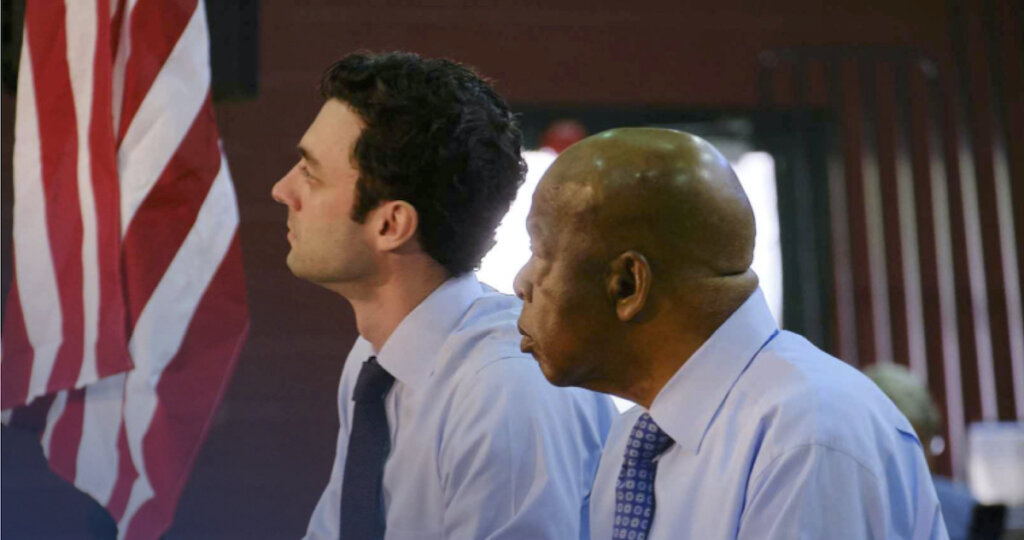 Senate challenger Jon Ossoff of Georgia sits with Congressman John Lewis.