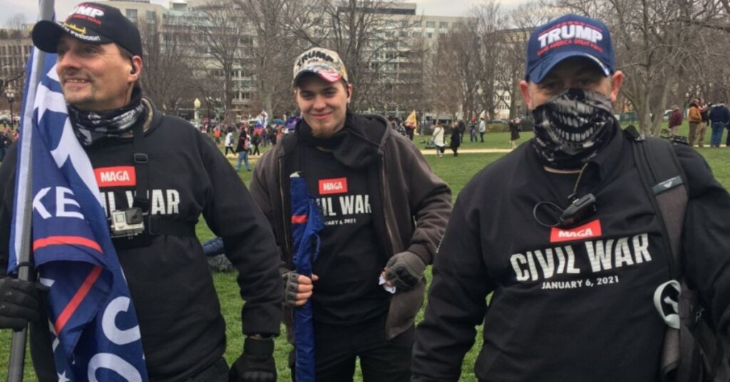 Three men wearing MAGA Civil War shirts on their way to the capitol.