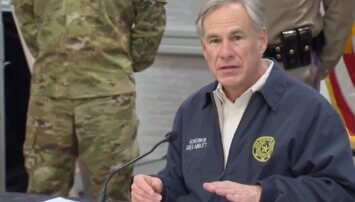 Texas governor speaking into a microphone