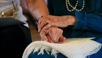 Two people holding hands